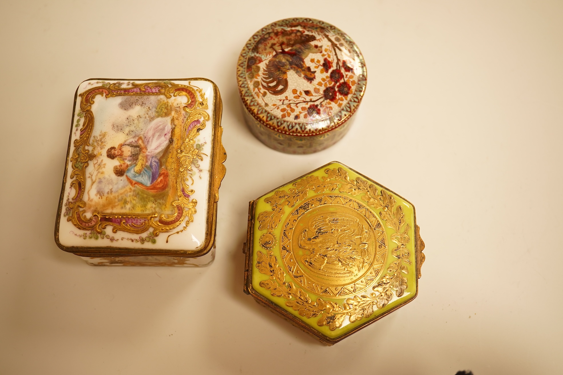 A Zsolnay lustre 'chicken' box and cover and two Sevres style porcelain boxes and covers (3) ‘chicken box’ 5cm diameter.